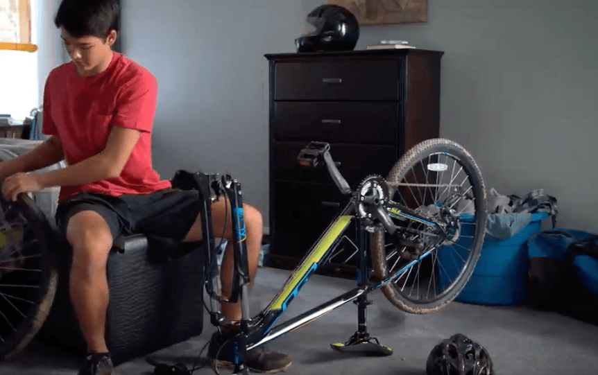 Boy repairing bycycle on Carpet | Pilot Floor Covering